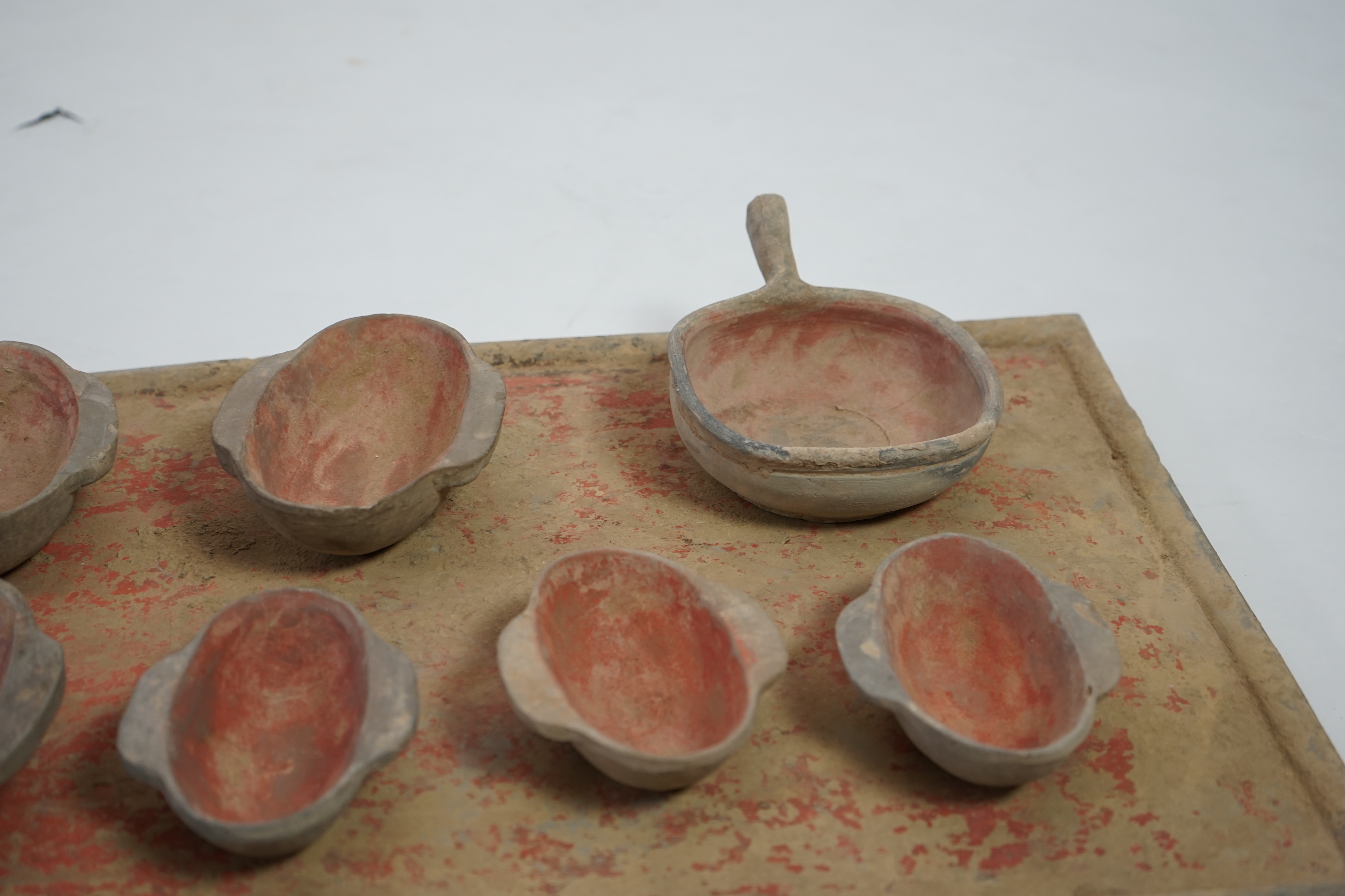 A large Chinese painted pottery tray, ladle and cups set, Han dynasty (206 BC-AD 220)